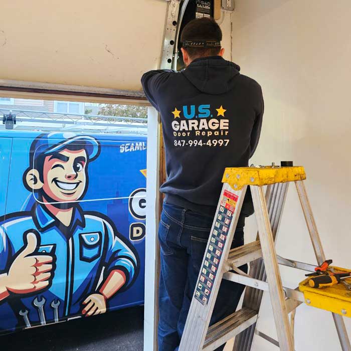 US Garage Door Repair technician fixing a broken garage door opener near Mount Prospect, IL