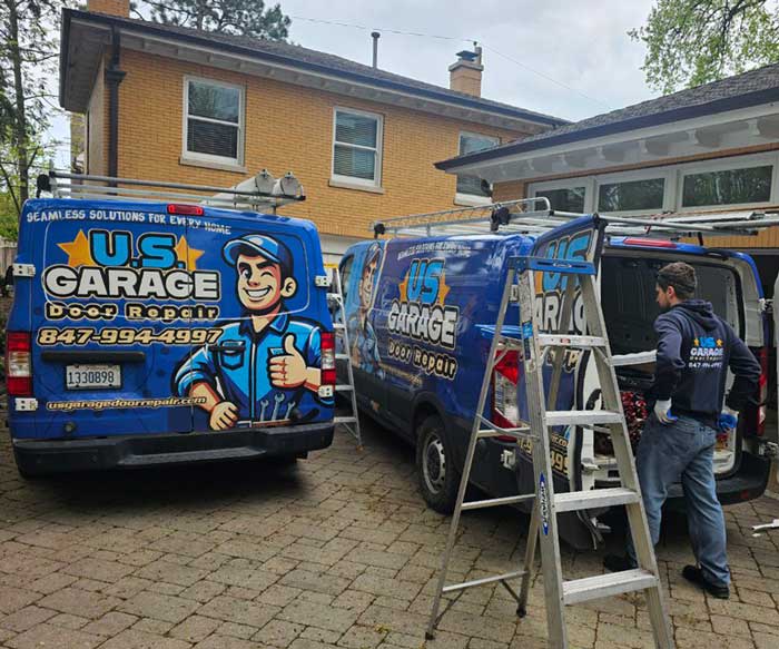 US Garage Door Repair work trucks by a customer's house in Vernon Hills, IL
