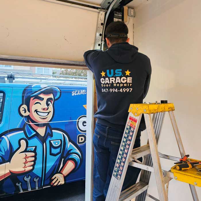 US Garage Door Repair technician fixing garage door cable near Vernon Hills, IL