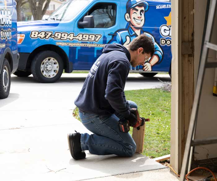 USGDR technician fixing garage door near Libertyville IL